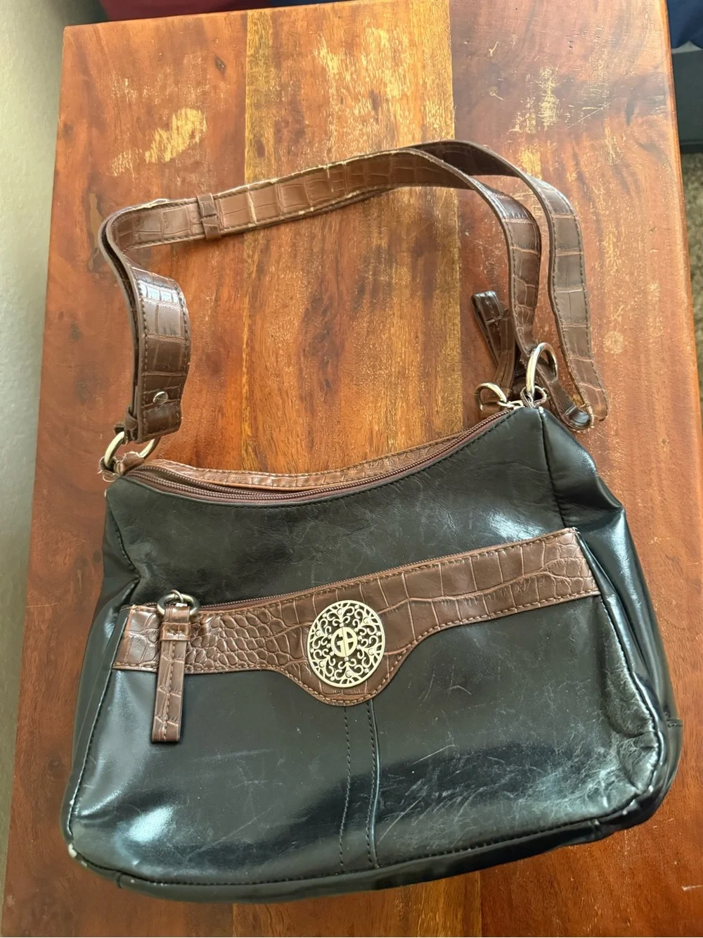 Women’s Brown and Black Shoulder Bag with Decorative Emblem